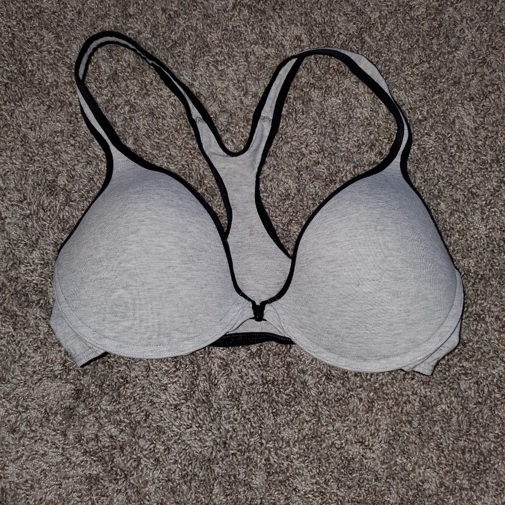 Two of the gray and pink bra and one of the white